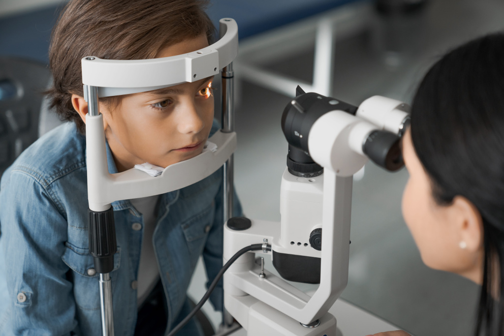 female-doctor-ophthalmologist-doing-basic-eye-examination-cute-boy-modern-clinic (1) (1).jpg